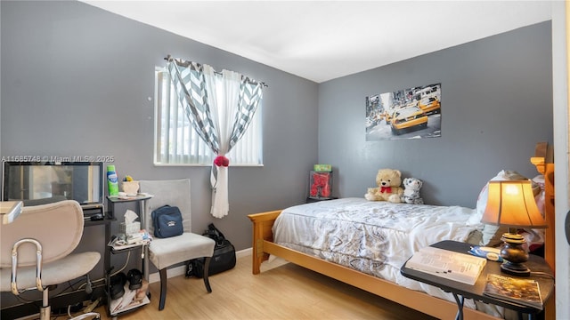 bedroom featuring hardwood / wood-style floors