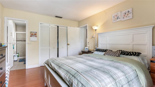 bedroom featuring a closet and light hardwood / wood-style floors