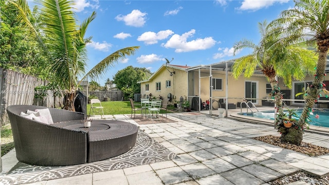 view of patio / terrace with a fenced in pool