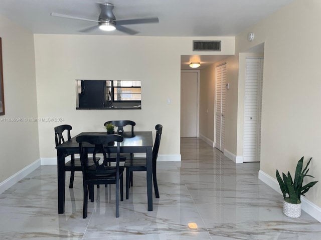 dining space featuring ceiling fan