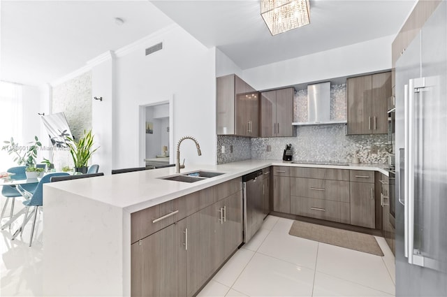 kitchen with wall chimney range hood, black electric cooktop, dishwasher, ornamental molding, and sink