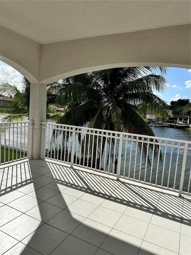 balcony featuring a water view