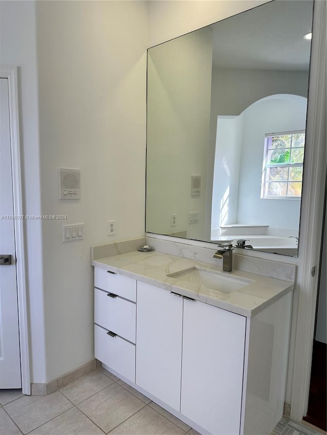 bathroom featuring tile patterned flooring and vanity