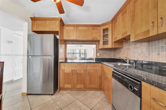 kitchen with tasteful backsplash, appliances with stainless steel finishes, sink, ceiling fan, and light tile patterned floors