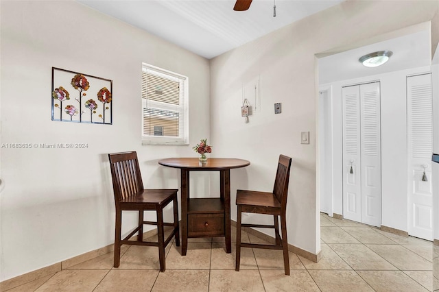 dining area with ceiling fan and light tile patterned floors