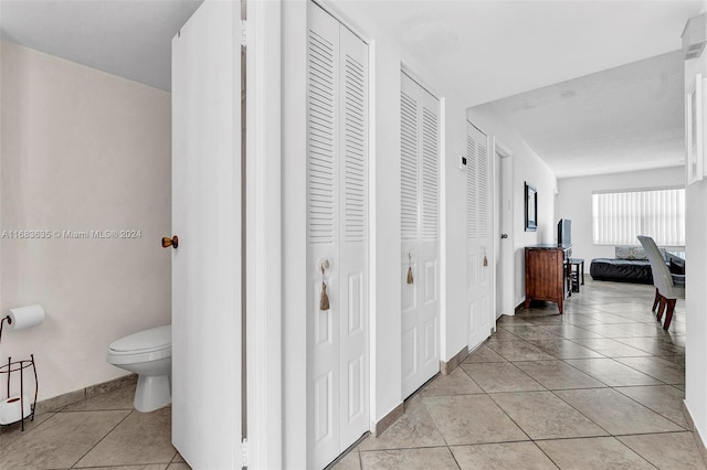 hallway featuring light tile patterned flooring