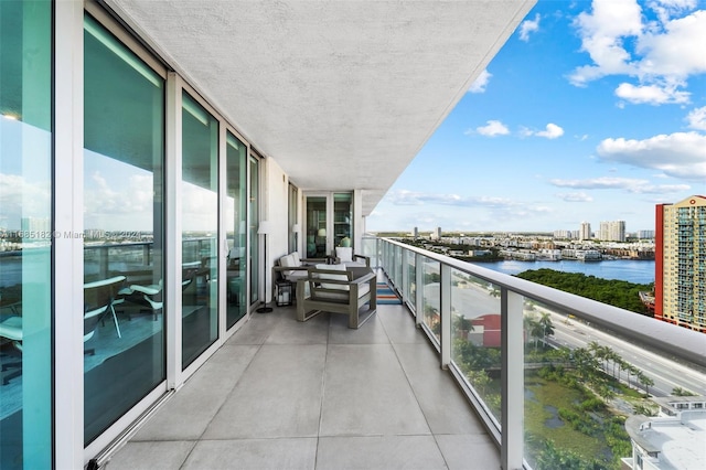 balcony featuring a water view