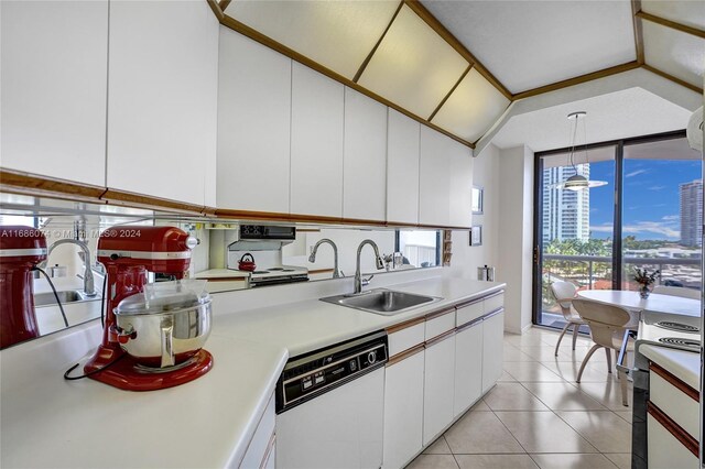 kitchen with white appliances, sink, light tile patterned floors, white cabinets, and hanging light fixtures