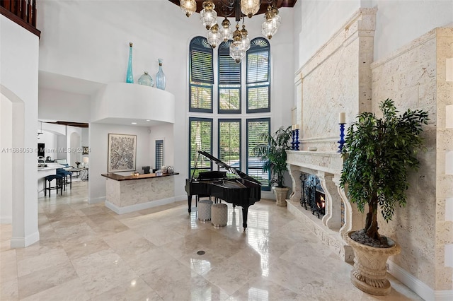 foyer entrance with a notable chandelier and a high ceiling