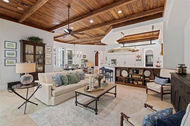 living room featuring light tile patterned flooring, beamed ceiling, wooden ceiling, and ceiling fan with notable chandelier