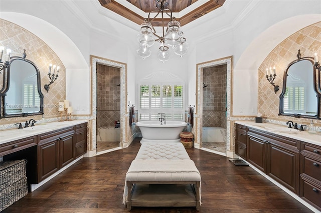 bathroom featuring hardwood / wood-style floors, tile walls, and a healthy amount of sunlight