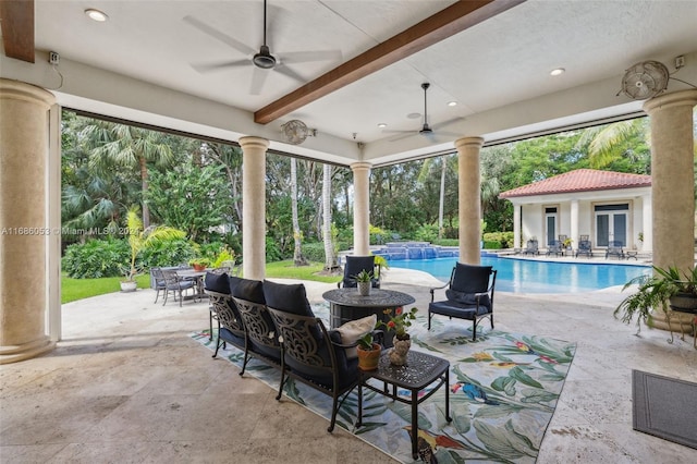 view of patio with outdoor lounge area, ceiling fan, and an outdoor structure