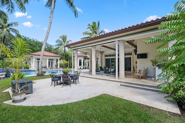 view of patio / terrace featuring ceiling fan