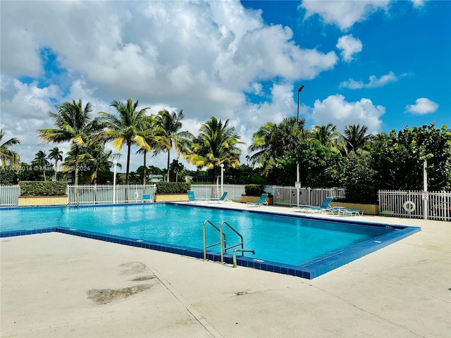 view of swimming pool featuring a patio area