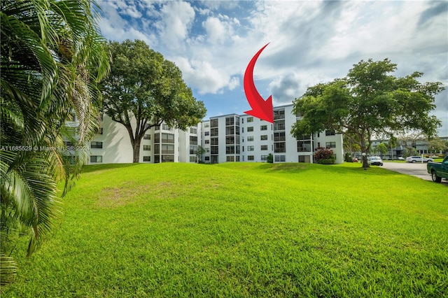 view of community featuring a yard