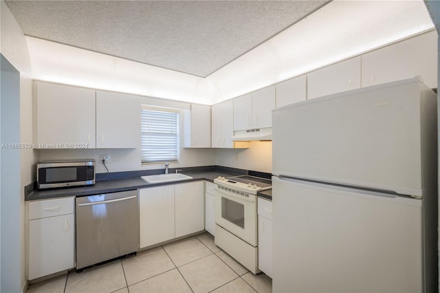 kitchen with a textured ceiling, white cabinetry, sink, and stainless steel appliances