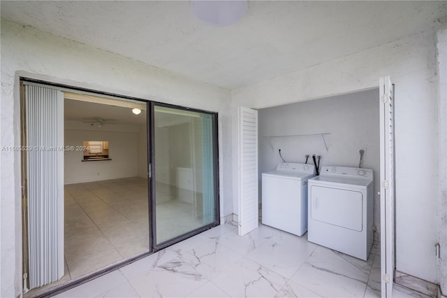 clothes washing area with washing machine and clothes dryer