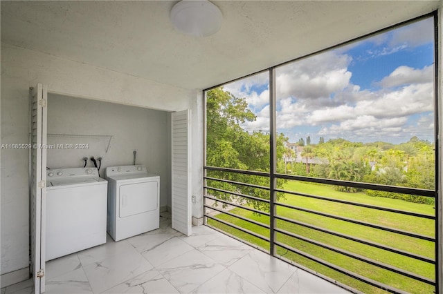 laundry room with a wealth of natural light and washer and dryer