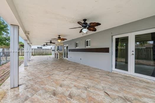 view of patio / terrace featuring ceiling fan and french doors