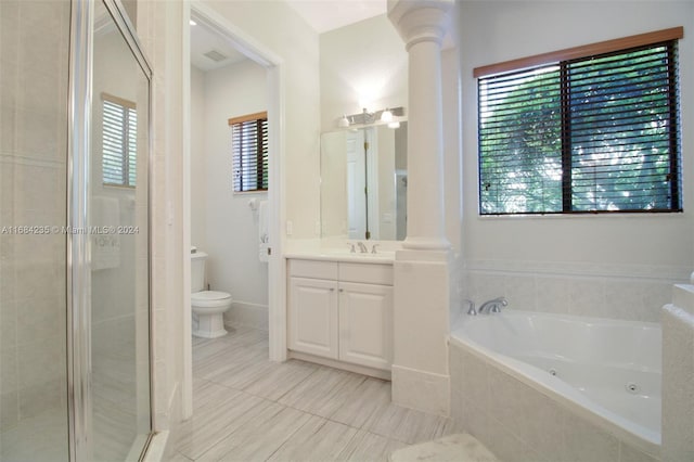 full bathroom with tile patterned flooring, separate shower and tub, decorative columns, toilet, and vanity