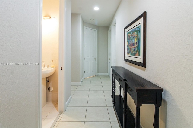 hallway featuring light tile patterned flooring