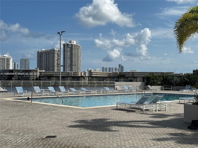 view of swimming pool featuring a patio