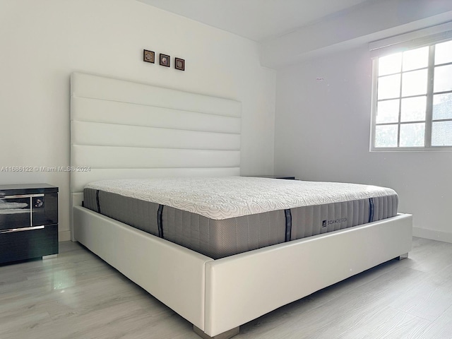 bedroom featuring light wood-type flooring