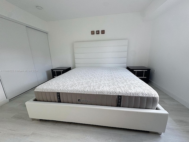 bedroom featuring a closet and hardwood / wood-style floors