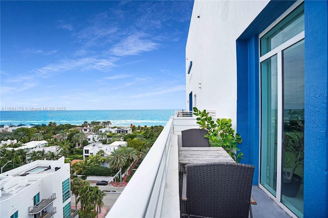 balcony featuring a water view