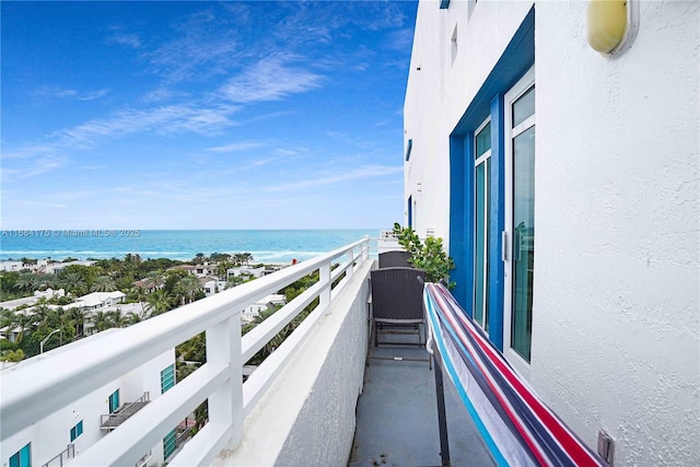 balcony featuring a water view