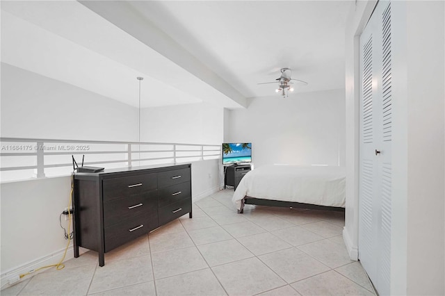 tiled bedroom featuring a closet