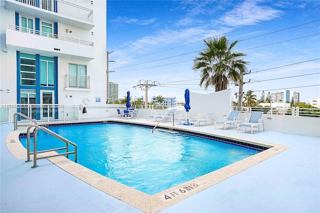 view of pool featuring a patio