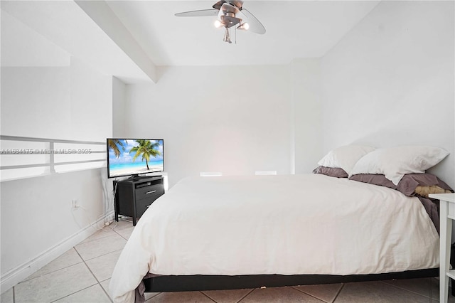 tiled bedroom with ceiling fan