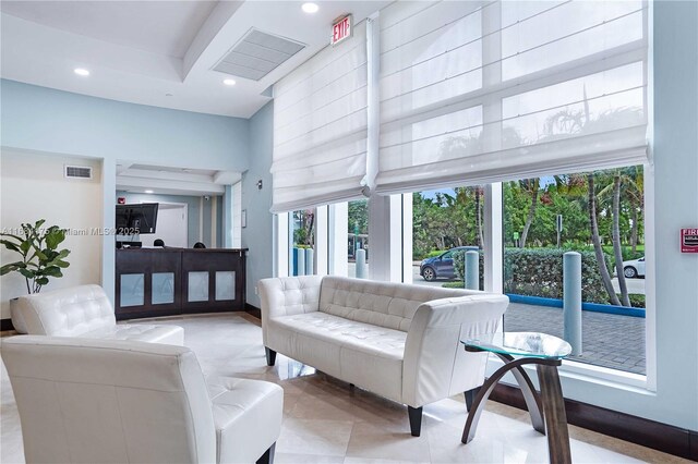 living room with a towering ceiling