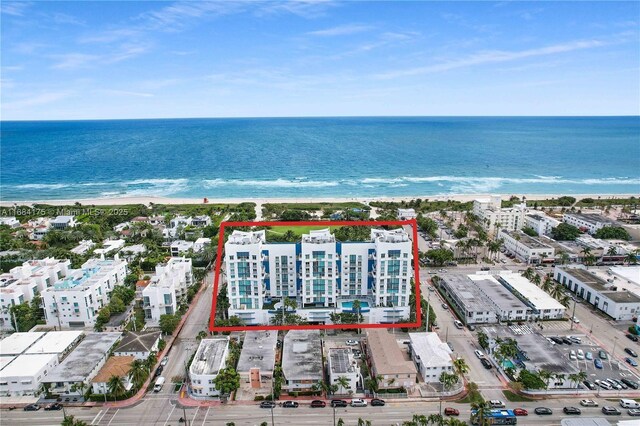 bird's eye view with a view of the beach and a water view