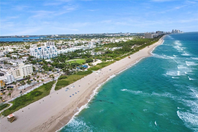 aerial view with a water view and a view of the beach