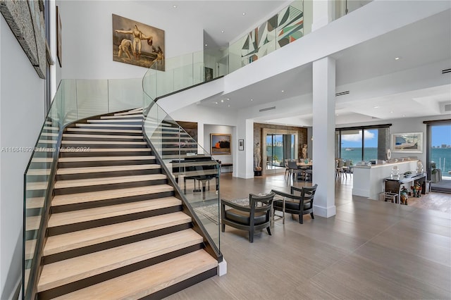 stairway with a towering ceiling