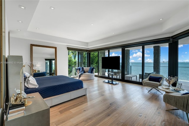 bedroom featuring light hardwood / wood-style flooring and access to exterior