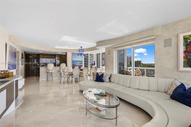 living room with an inviting chandelier