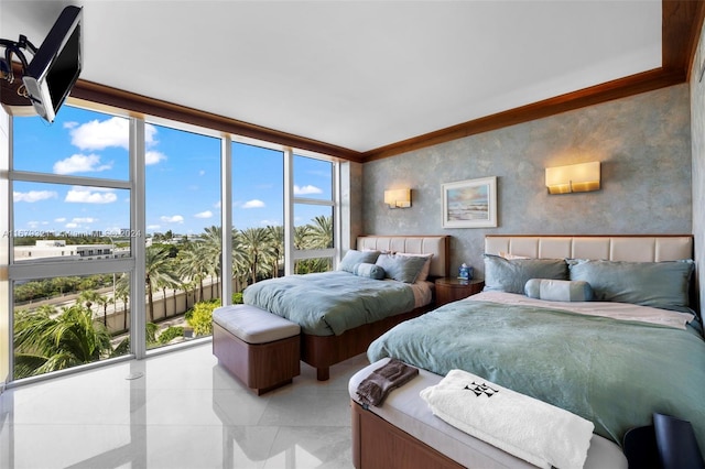 bedroom with ornamental molding, expansive windows, and multiple windows