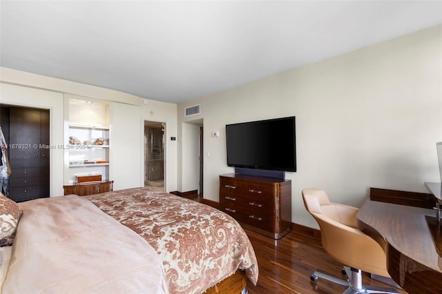 bedroom featuring dark hardwood / wood-style floors