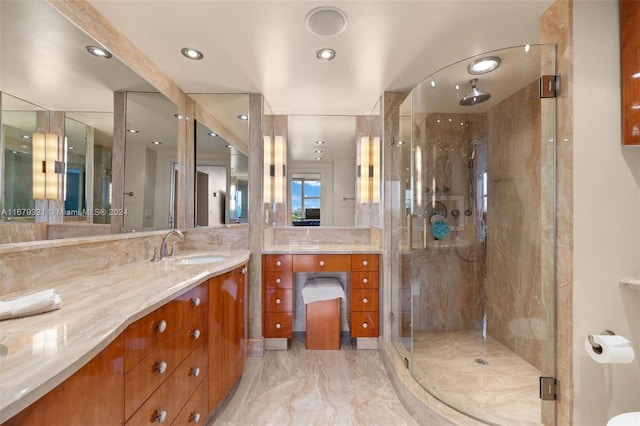 bathroom featuring vanity and a shower with shower door