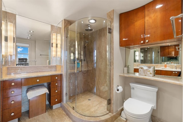 bathroom featuring vanity, tile patterned floors, toilet, and an enclosed shower