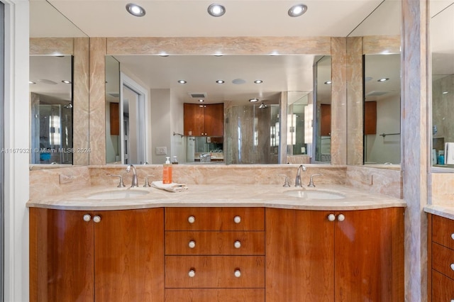 bathroom with vanity and an enclosed shower