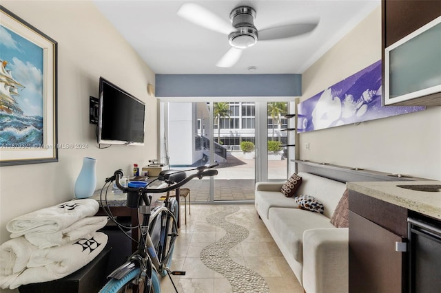 interior space featuring light tile patterned flooring and ceiling fan