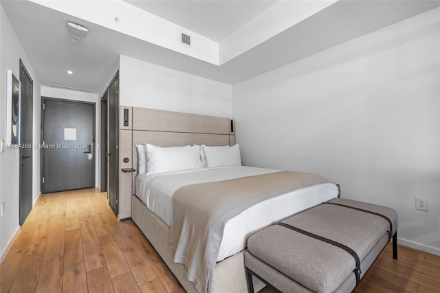 bedroom with light hardwood / wood-style floors