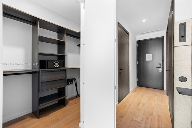 corridor featuring light hardwood / wood-style floors