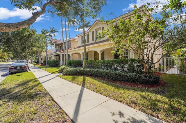 view of side of property with a yard