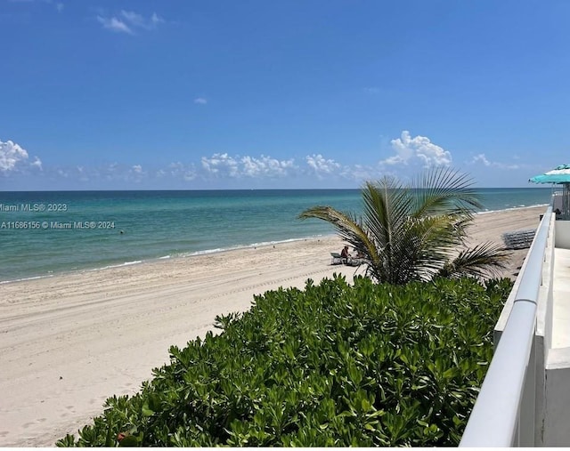 property view of water featuring a beach view