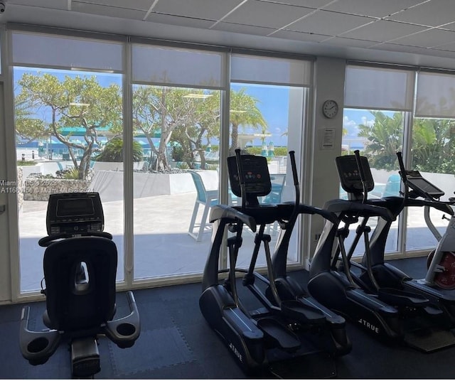 gym featuring a drop ceiling